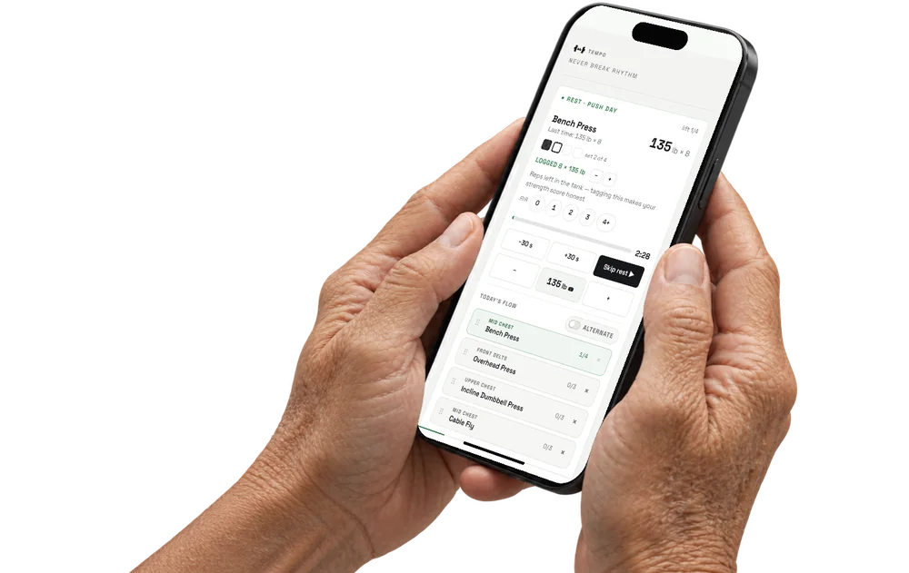 A phone in hand showing the TEMPO rest timer